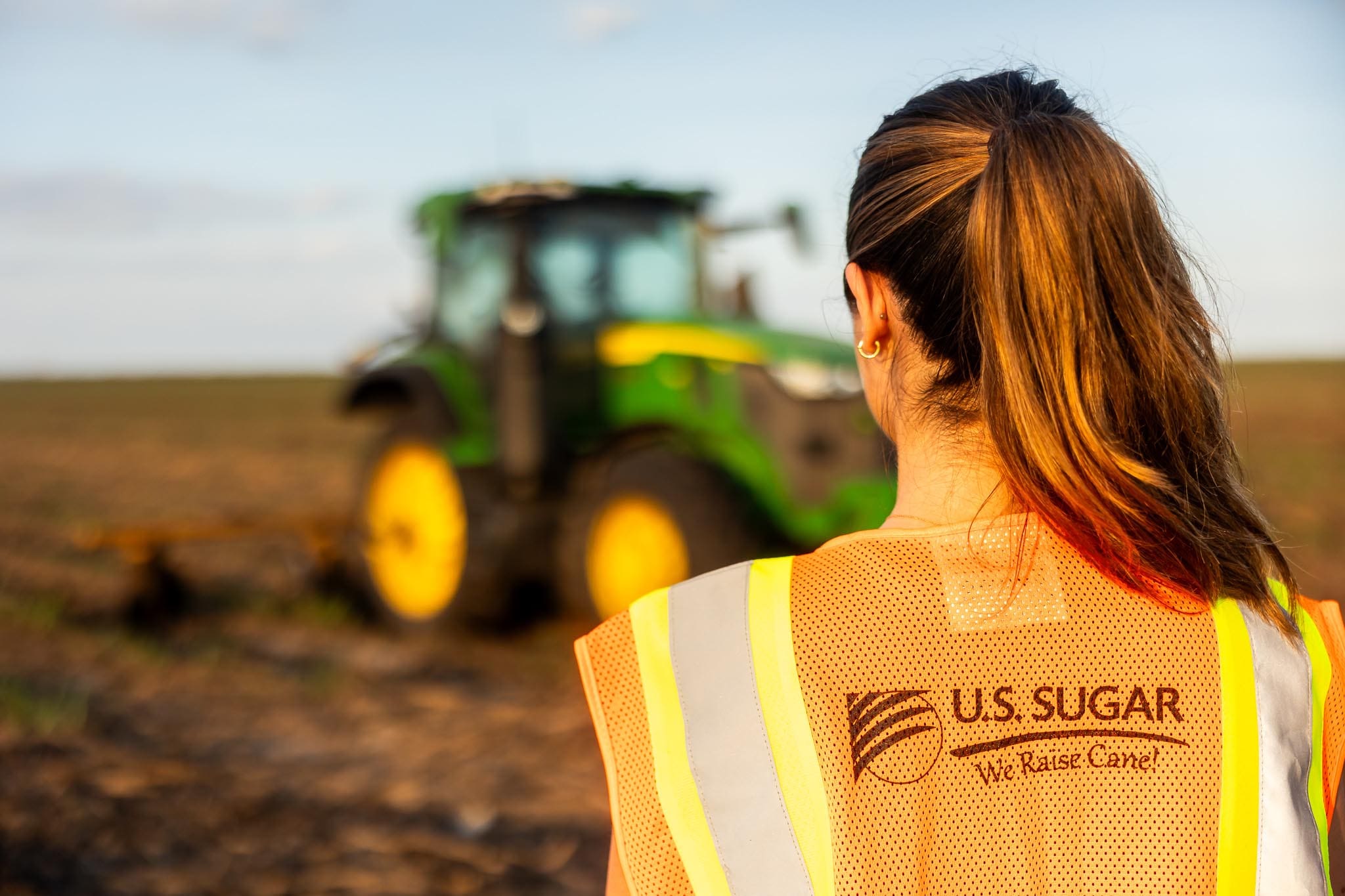 U.S. Sugar Specialty Products customer service representative wearing a company safety vest