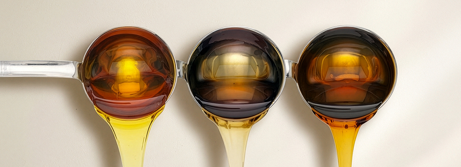 Thick, dark cane molasses being poured, highlighting the rich color and viscosity of U.S. Sugar's product