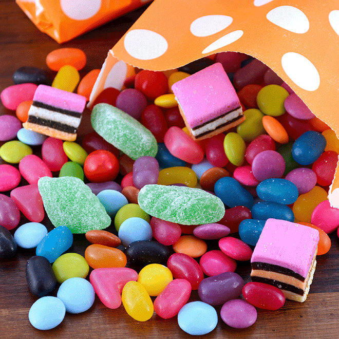 Animated food and beverage graphic showing ham, candy, spices, and a cocktail representing cane sugar applications.