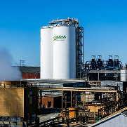 U.S. Sugar processing facility with storage tanks and infrastructure used to produce and refine sugar products.